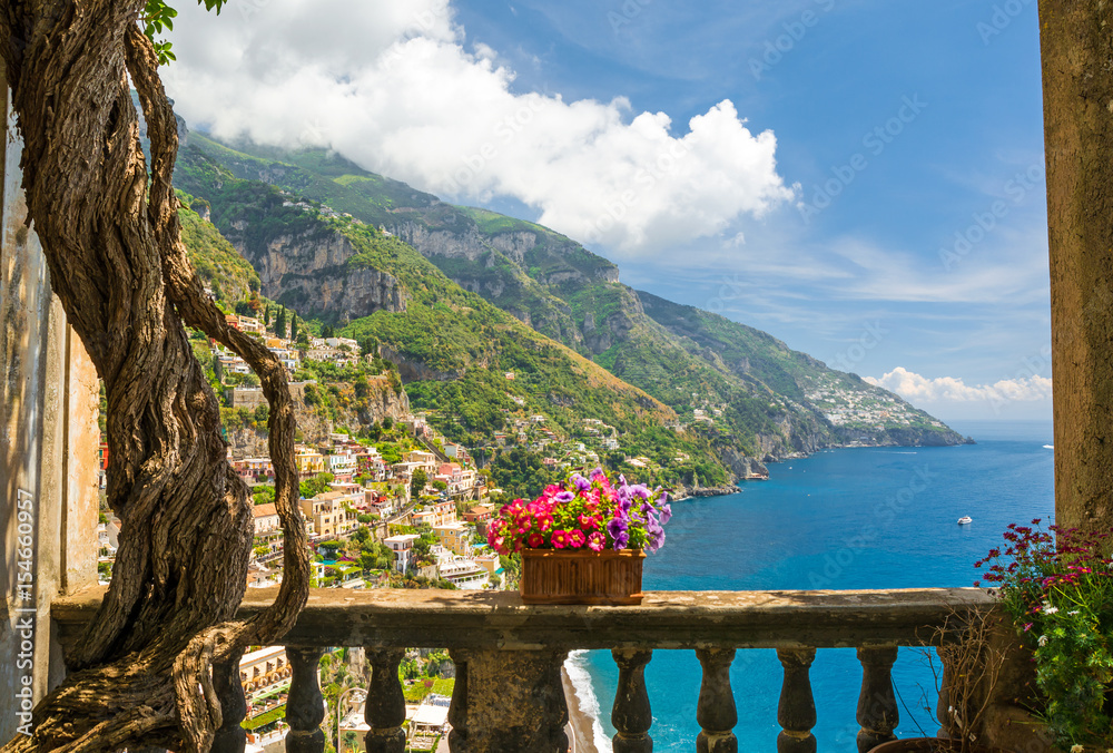 beautiful view of the town of Positano from antique terrace with flowers - obrazy, fototapety, plakaty 