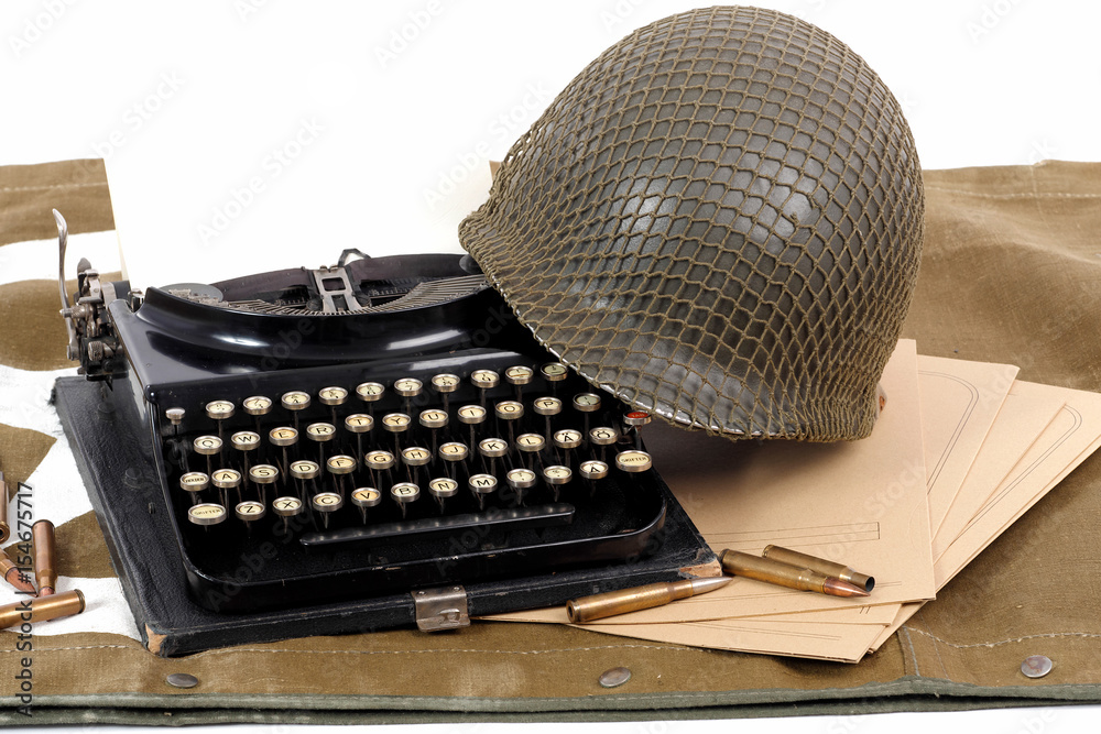 US military helmet of the Second World War with old typewriter Stock ...