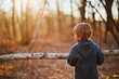 © RooM The Agency - Boy carrying piece of birch wood in forest