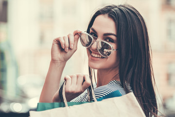 Wall Mural - Beautiful girl doing shopping