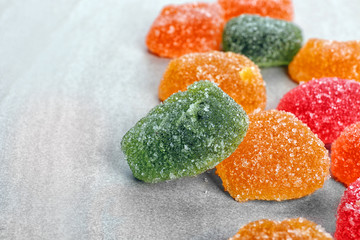 Sticker - Tasty jelly candies on light background