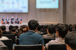 © THANANIT - Rear view of Audience over the speakers on the stage in the conference hall or seminar meeting, business and education concept