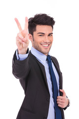 Wall Mural - smiling man making the victory sign