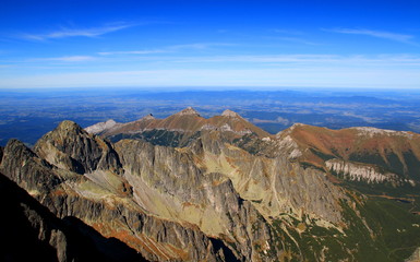 Belianske Tatras and northern part of High Tatras main ridge in Slovakia, including Dolina Zeleneho Plesa Valley, Kolovy and Jahnaci peaks, in the background Dunajec valley, Beskids mountain in Poland