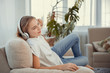 © svetabezu - Beautiful teenage girl with smartphone and headphones listening music.
