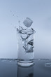 water in glass with drop ice