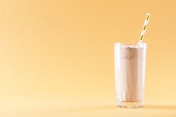 Wall Mural - banana chocolate smoothie on a solid background