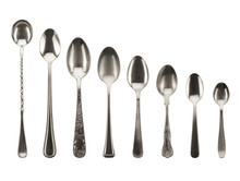8 Different Sized Silver Toned Spoons On White Background