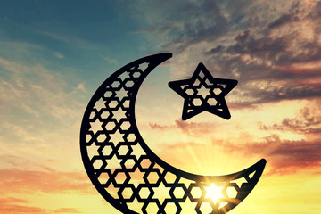 Wall Mural - Ramadam Kareem moon and star against sunrise/sunset background. 3D Rendering