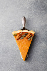 Wall Mural - Pumpkin pie, tart made for Thanksgiving day. Grey stone background. Top view