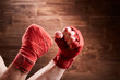 © Aleksey - Close-up of hands with bandage of boxer ready for a fight against wooden wall.