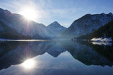 Fototapeta Góry - Winter mountain reflections in Plan See, Austria