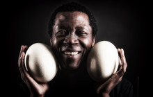 Handsome African Black Man With Ostrich Egg.