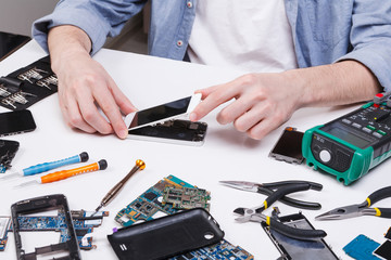 Poster - Repairman disassembling phone for inspecting
