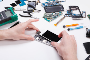 Poster - Repairman disassembling phone for inspecting