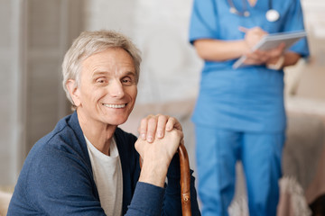 Wall Mural - Sweet elderly man receiving some advice from doctor