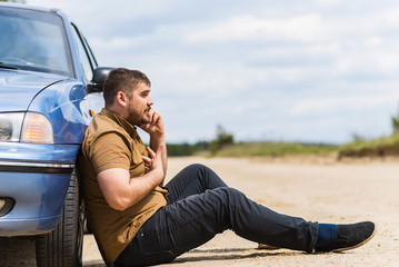 Wall Mural - Nervous driver calls to the help desk by phone