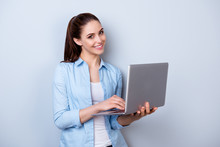 Young Happy Smiling Woman In Casual Clothes Holding Laptop And Sending Email To Her Best Friend