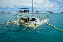Sunken Sailboat In Galapagos In A Beautiful Blue Water