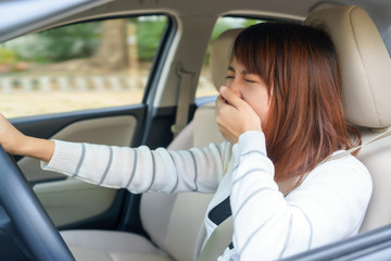 Sleepy, yawn, close eyes young woman driving her car after long hour trip, Sleep deprivation, accident concept.