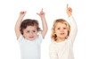 © Gelpi - Two babies with their hands raised asking for the word
