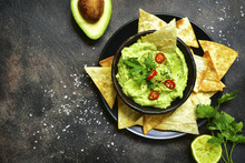 Avocado Dip Guacamole With Tortilla Chips.Top View With Copy Space.