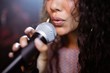 © WavebreakMediaMicro - Close up of female singer singing at nightclub