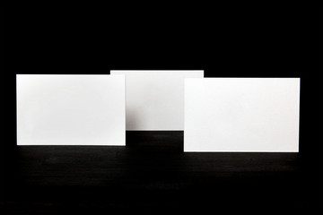 Wall Mural - Thick cardboard business cards, blank for copyspace, on black