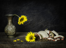 Classic Still Life With Sunflowers Placed On Rustic Wooden Background.Brokenness Concept