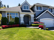 © tab62 - Well maintain front lawn of clean home during spring season