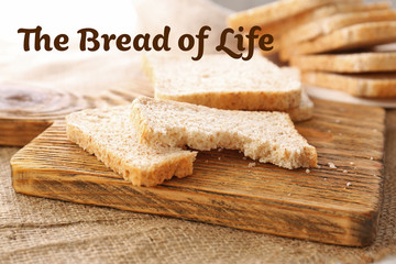 Wall Mural - Sliced bread on wooden cutting board closeup