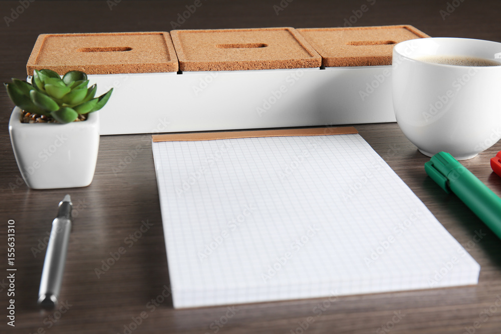 Empty notebook with pen, cup of coffee and accessories on table. Job interview concept