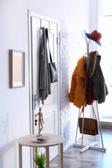 Wall Mural - Modern hall interior with hanging clothes