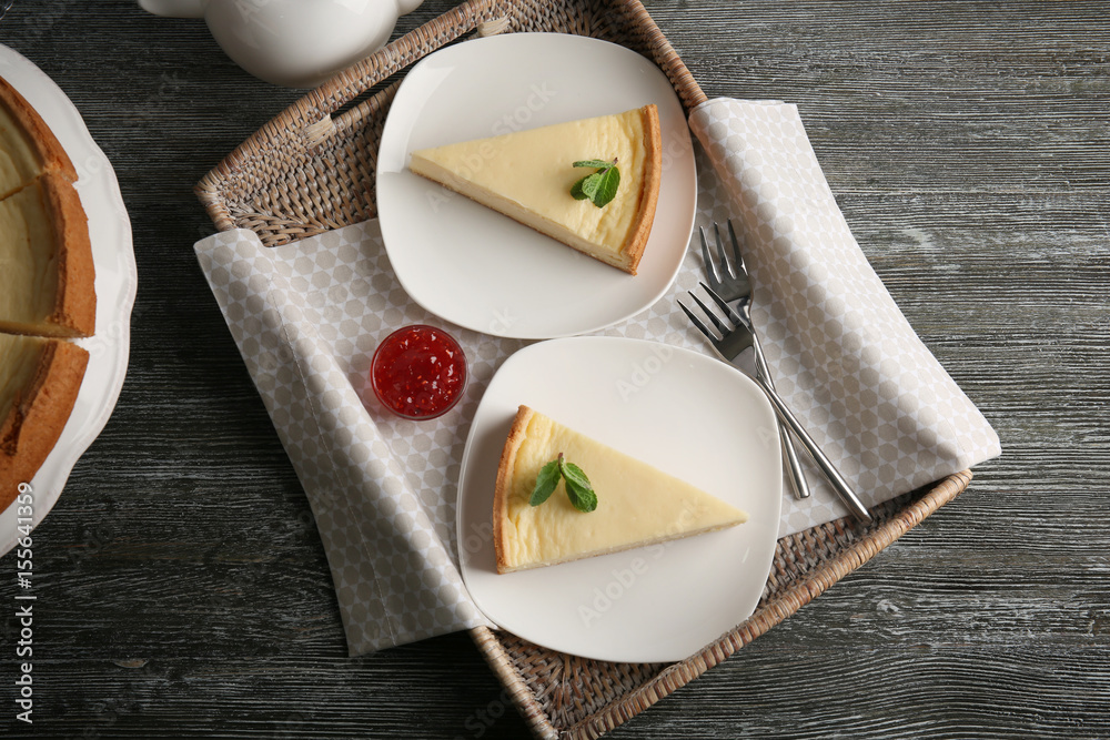 Composition with tasty cheesecake on wooden table