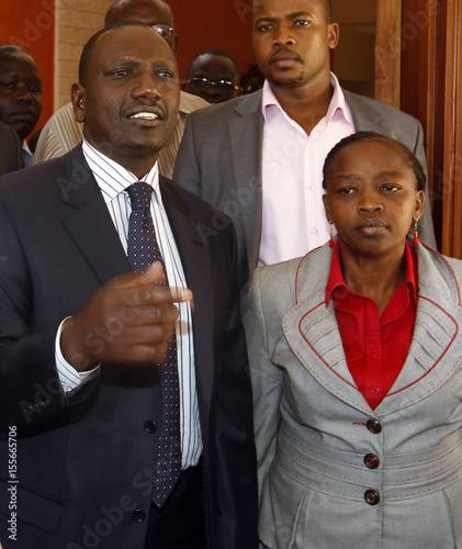 Former Kenyan Cabinet Minister Ruto Stands Next To His Wife Rachel