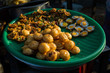 Burmese Street Snack. Dough balls sold as popular street snack in Kyaukme night market, Shan State, Myanmar.