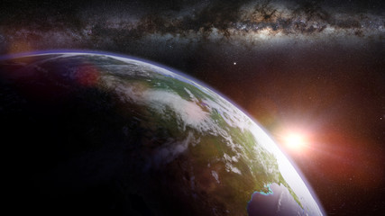 Wall Mural - sunrise on planet earth in front of the milky way galaxy