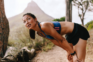 Wall Mural - Runner taking break after workout