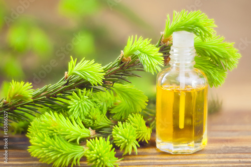 Fotografie, Obraz Essence of pine on table in beautiful glass jar