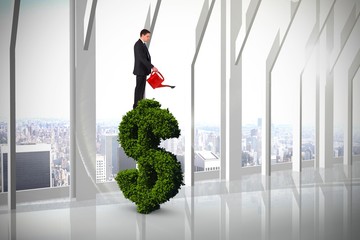Poster - Composite image of businessman holding red watering can