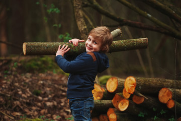 Wall Mural - little sweet lumberjack in autumn forest