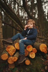 Wall Mural - little sweet lumberjack in autumn forest