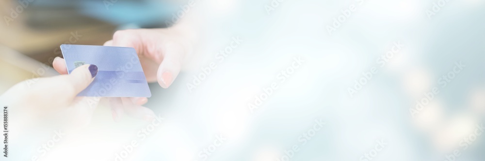 Cropped image of hand handing over credit card Stock Photo | Adobe Stock