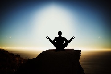 Wall Mural - Composite image of silhouette businessman practising yoga