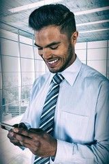 Poster - Composite image of smiling businessman using mobile phone