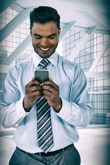 Poster - Composite image of smiling businessman using mobile phone