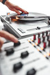 © goodmanphoto - a person using a turntable and mixing board.