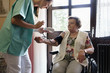 © Kzenon Premium - Nurse measuring blood pressure of senior woman in elderly care home