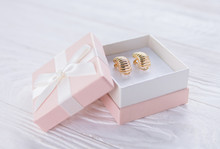 Gold Earrings In The Gift Box