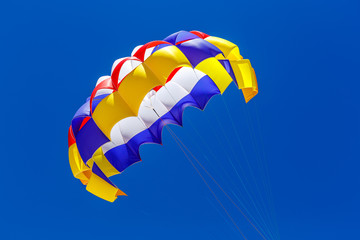 the colorful parachute in the blue sky